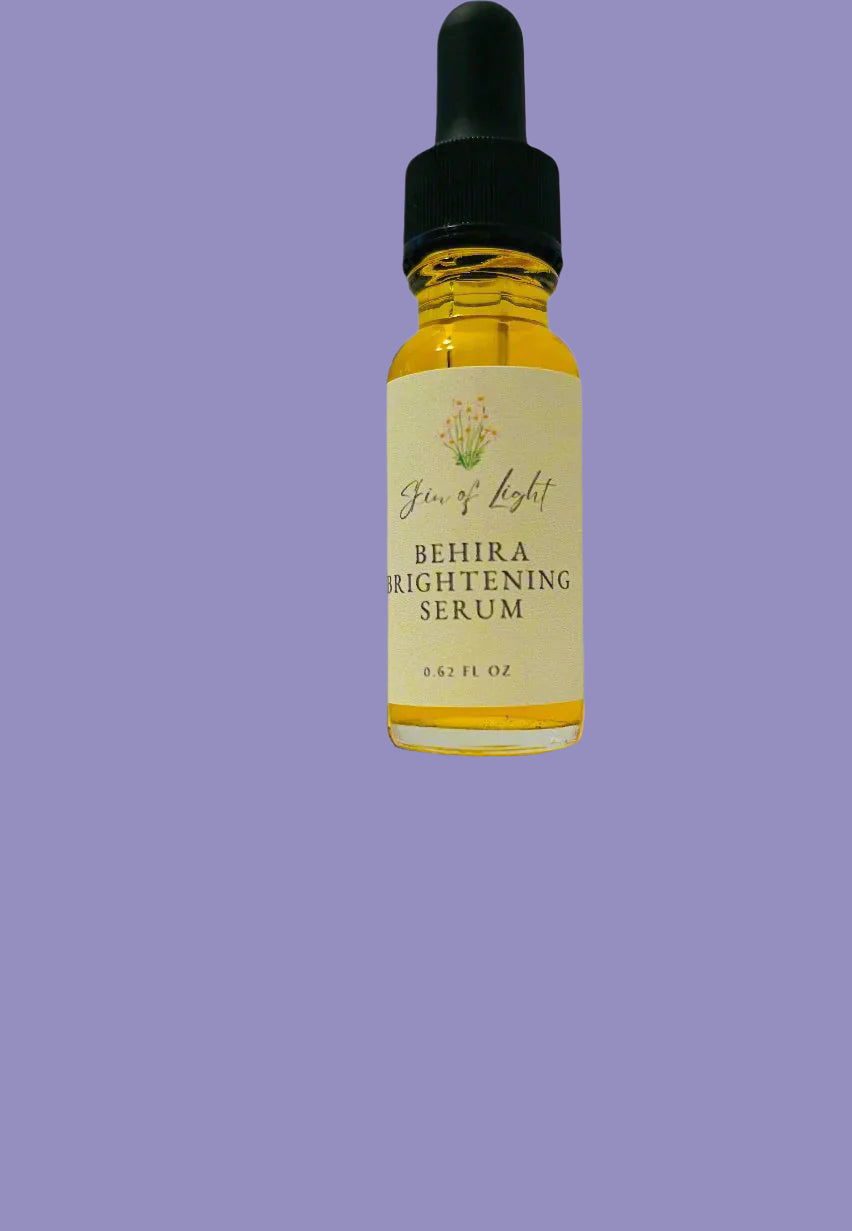 Behika Brightening Serum bottle with dropper against a forest background